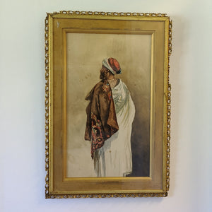 Water color painting of Arabic man with his back towards viewer. Framed.