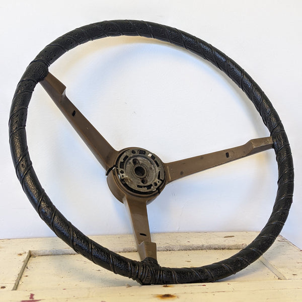 Black and brown vintage hot rod car wheel side
