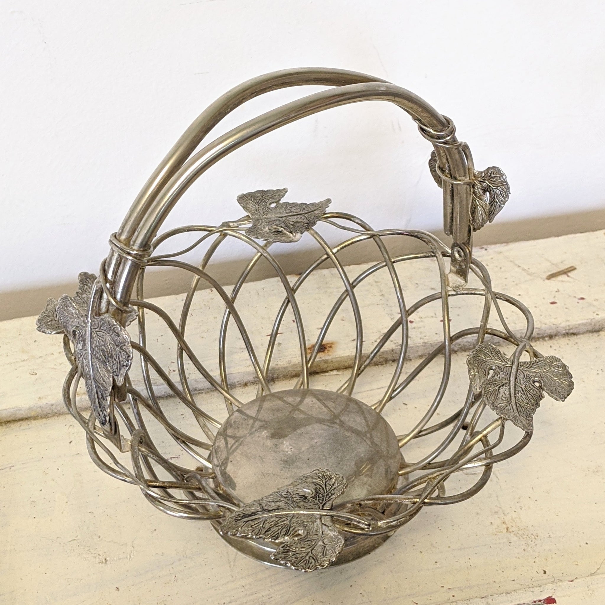 Vintage metal basket with leaves