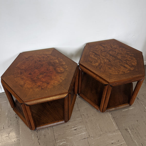 Two brown burl tables side-by-side, top view