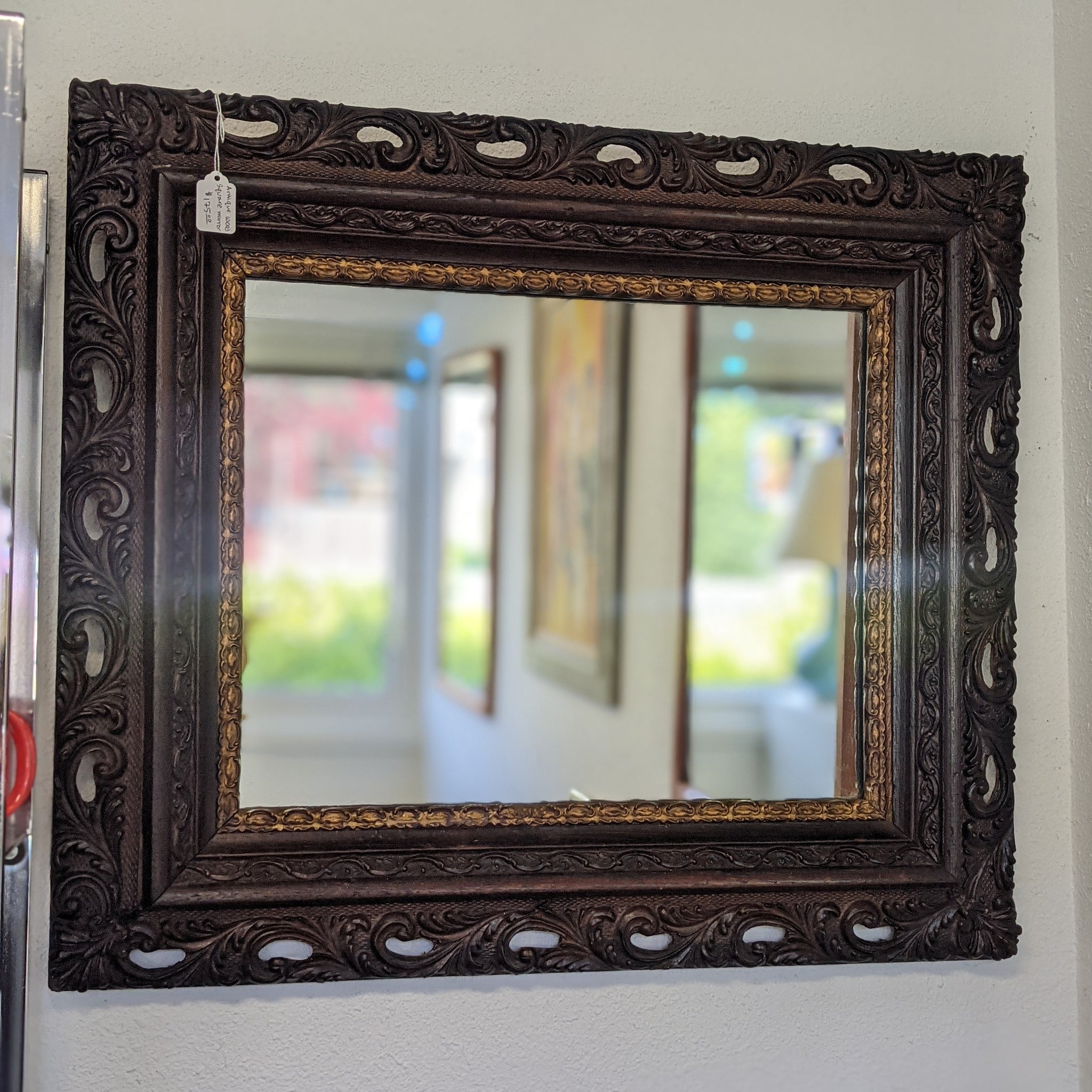 Mirror with dark wood and gold frame