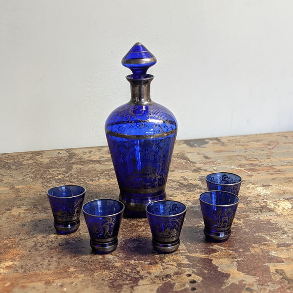 Blue decanter with five shot glasses